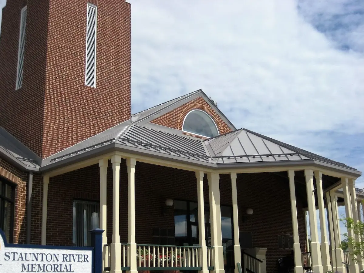 Skilled roofing craftsmen working on a residential roof in Oak Orchard
